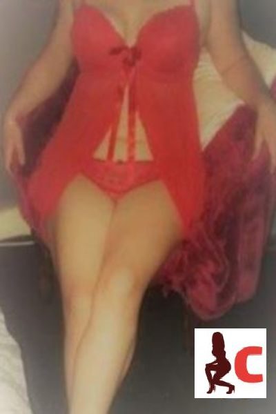 Carmarthenshire Escort wearing a red sexy outfit