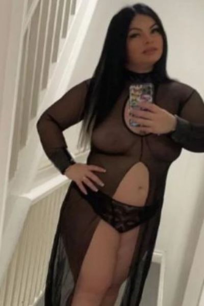 brunette Derby escort takes a selfie in see through robe