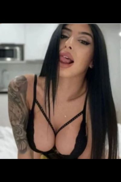 raven haired Portsmouth escort teasing with her tongue