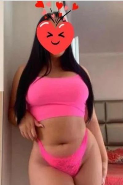busty and curvy Rhondda escort in pink lingerie