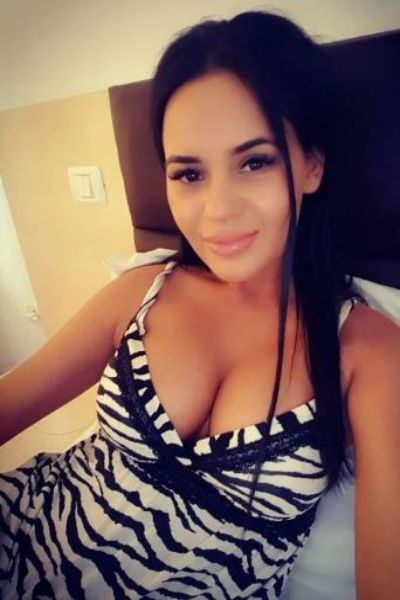 sexy young Huddersfield escort in zebra pattern dress