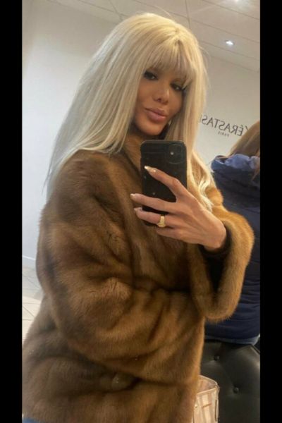 Sexy Tamara TS taking a selfie in a fur coat