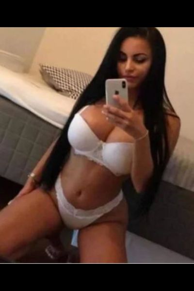 Sexy Escort in Doncaster looking busty in white lingerie