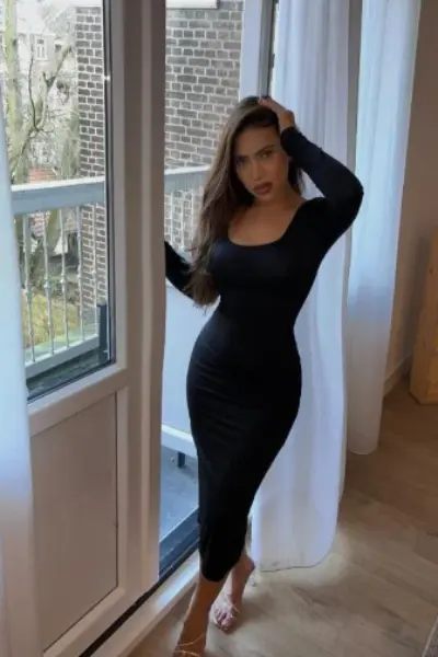 Arabic escort in a black dress