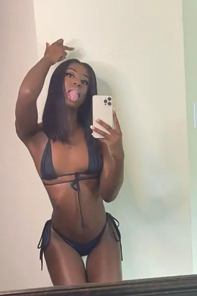 Ebony TS escort in small black bikini