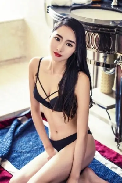 Asian lesbian escort in black swimsuit